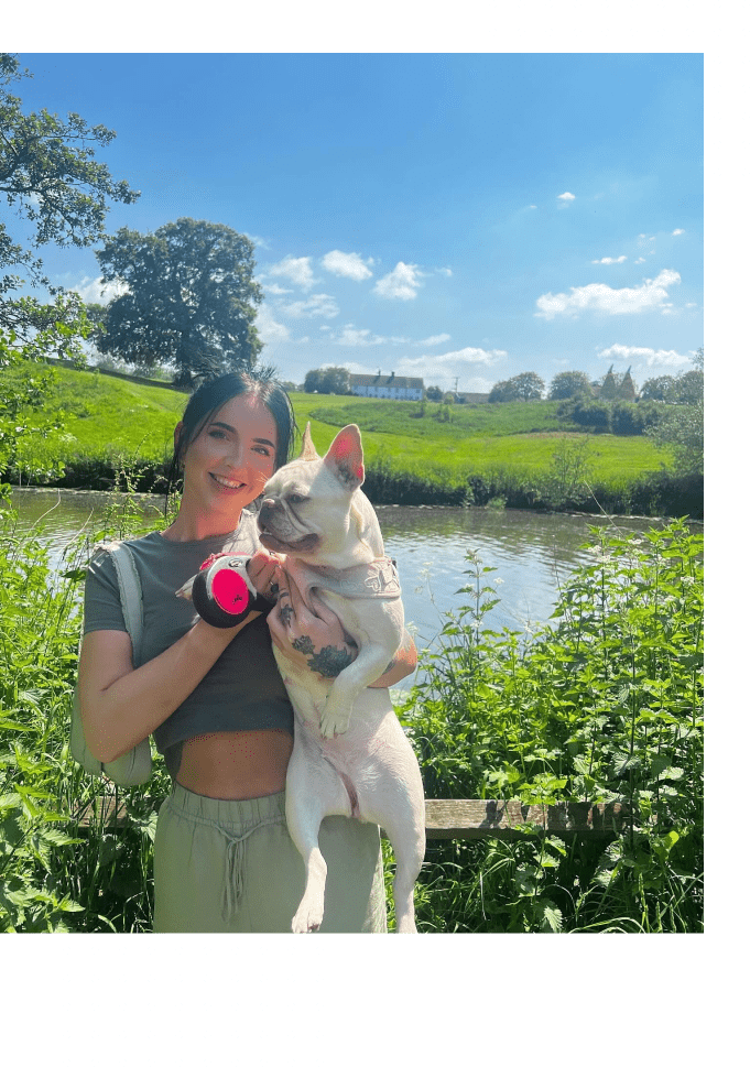 An image showing Shannon holding her dog, Wren